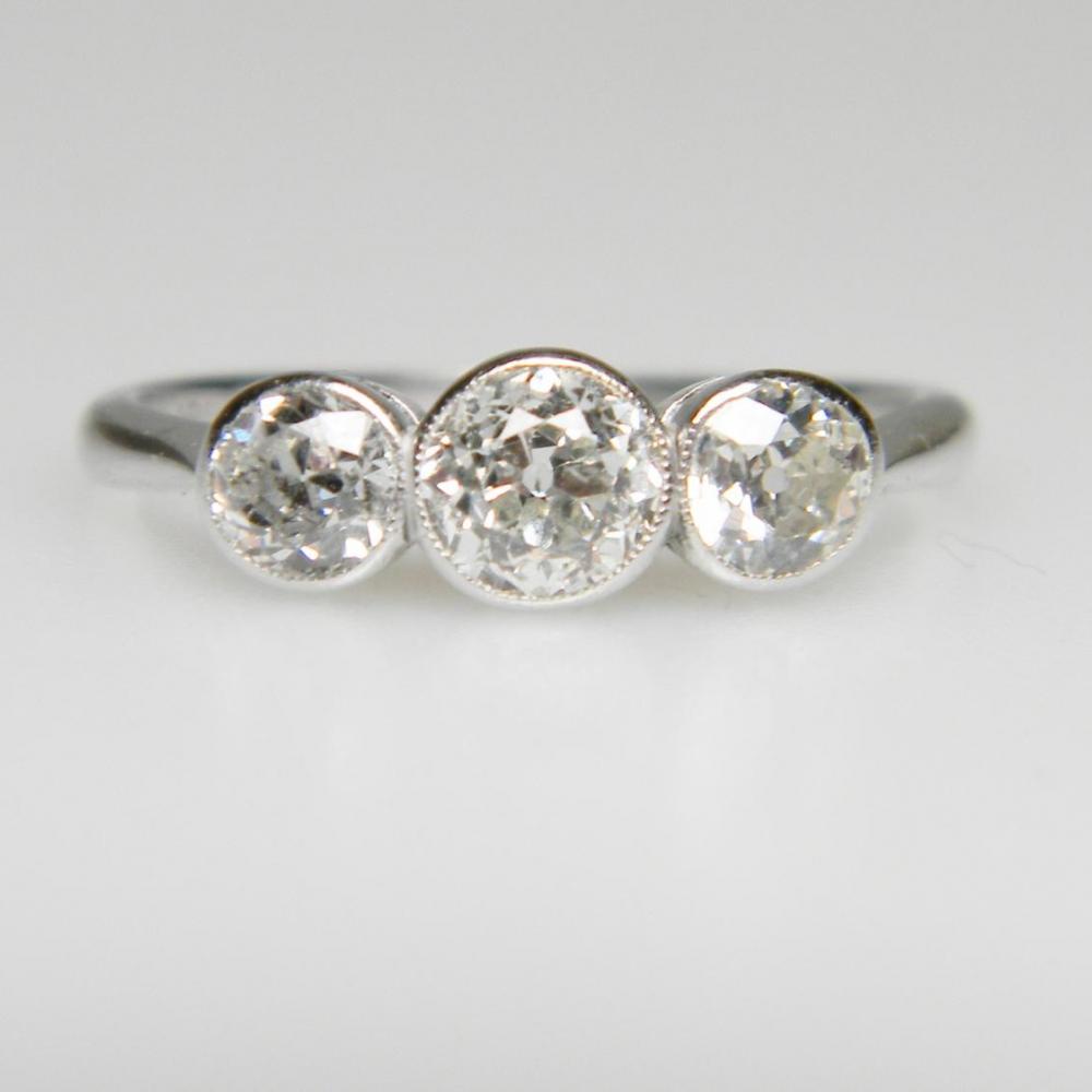 3 stone rub over diamond rings