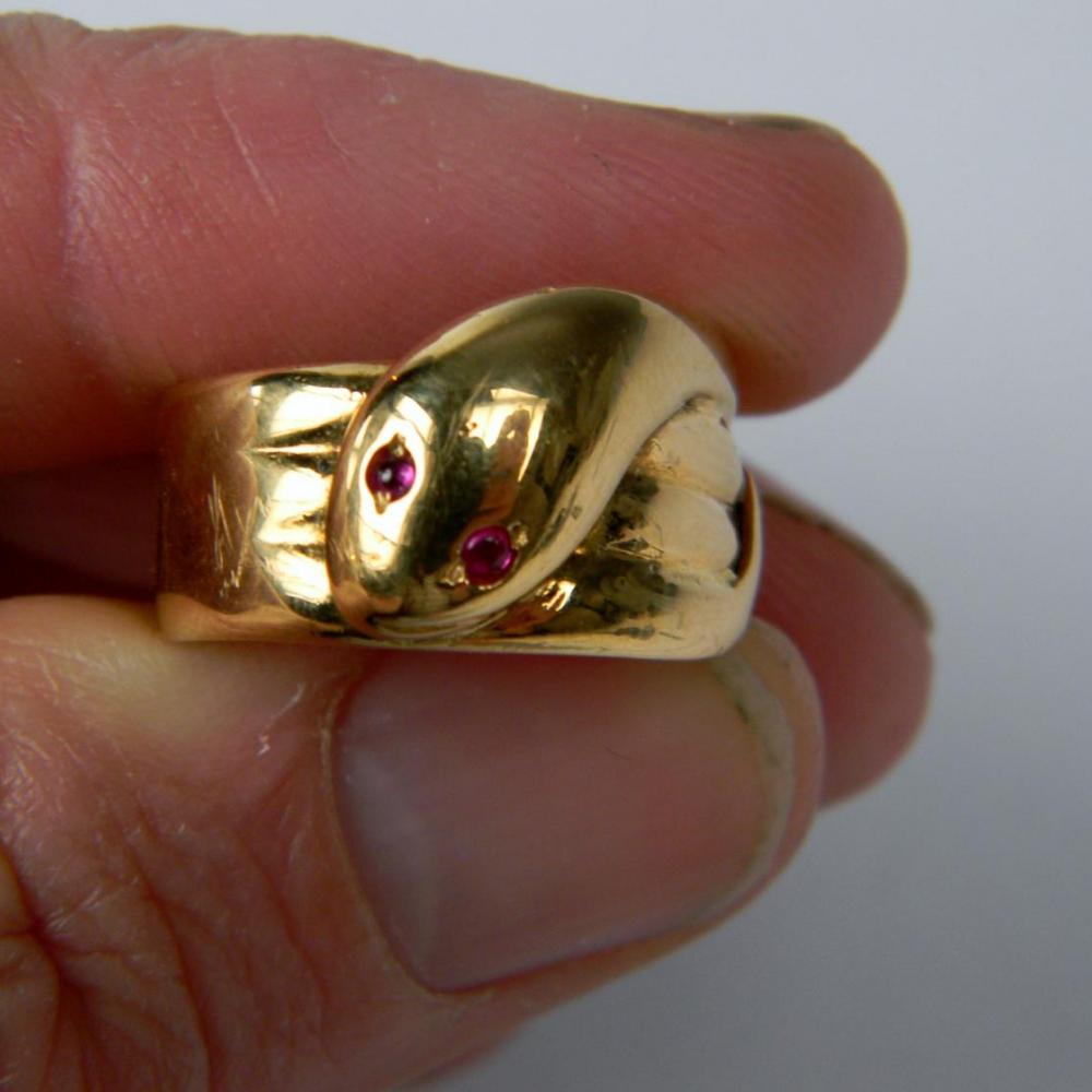 gold snake ring with ruby eyes meaning